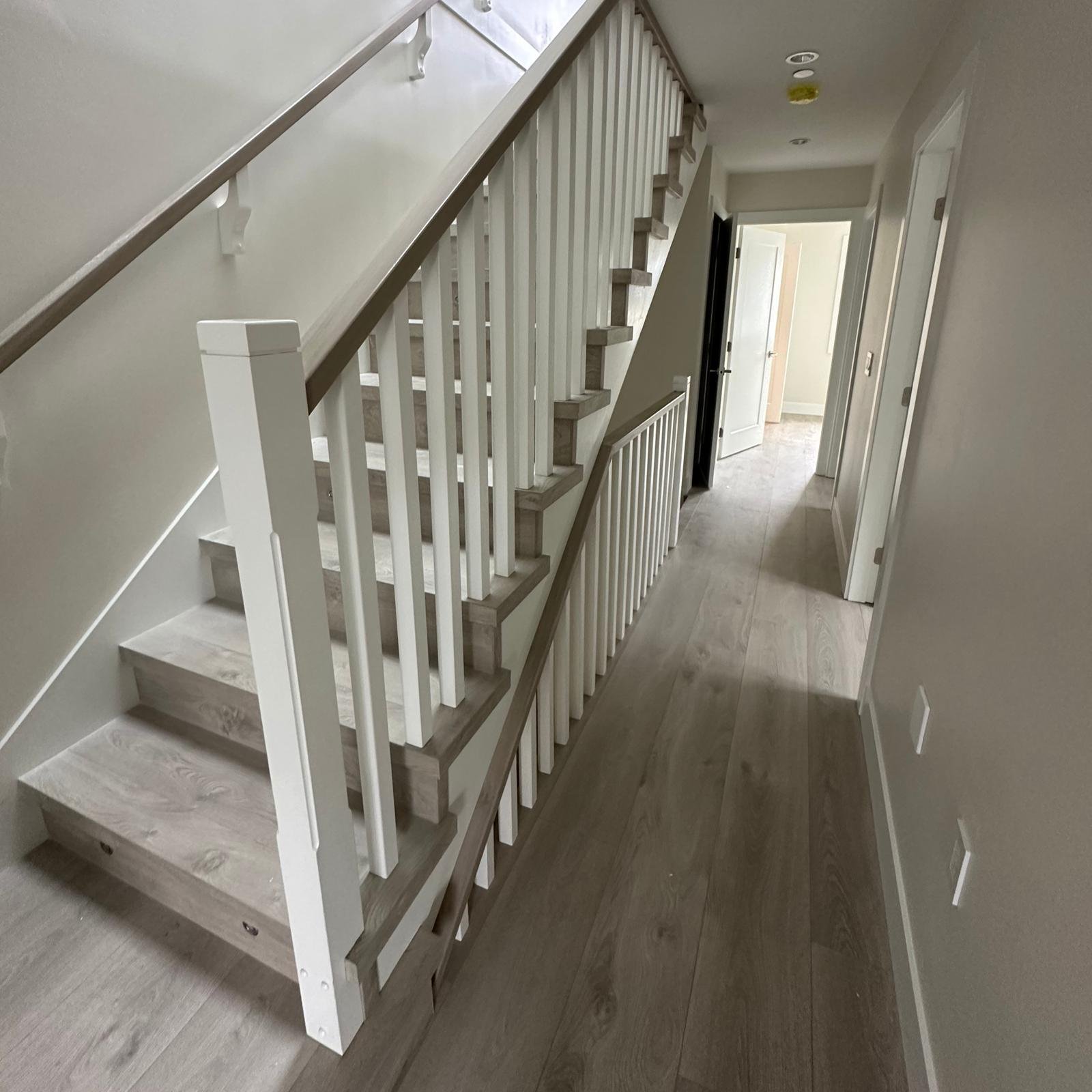 Professional vinyl plank stairs installation and custom nosing services by Flooring Oz Group in Metro Vancouver, BC
