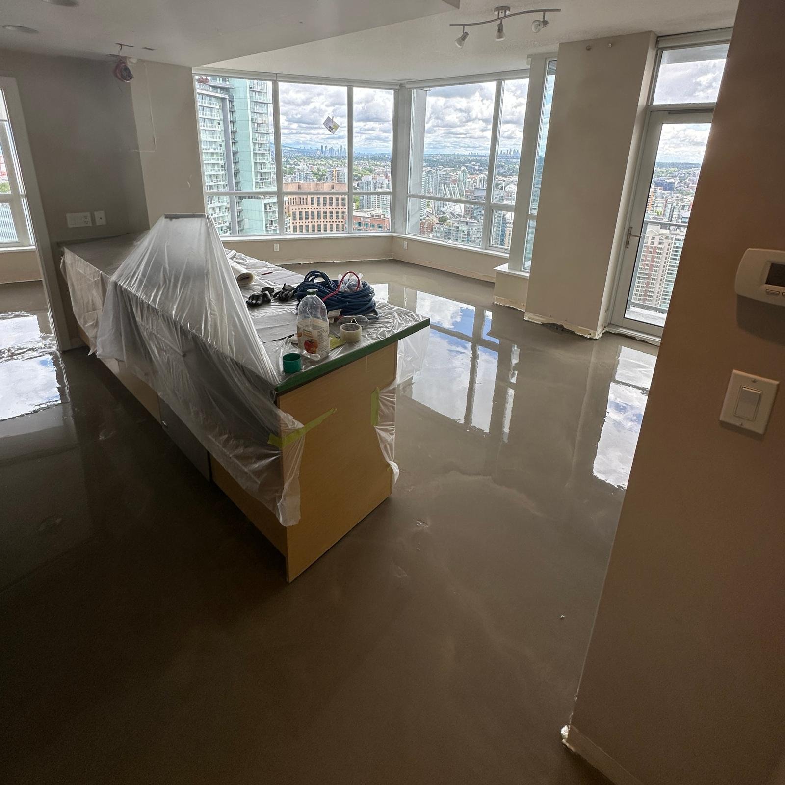 Expert subfloor preparation and self-leveling concrete application by Flooring Oz Group in Port Moody, BC